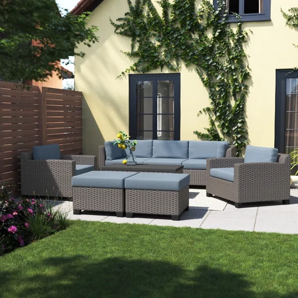 Amjad 8 Piece Outdoor Sectional Seating Group with Cushions