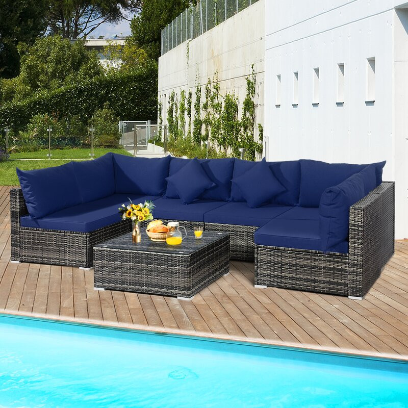 Amarjeet 7 Piece Rattan Sectional Seating Group with Cushions