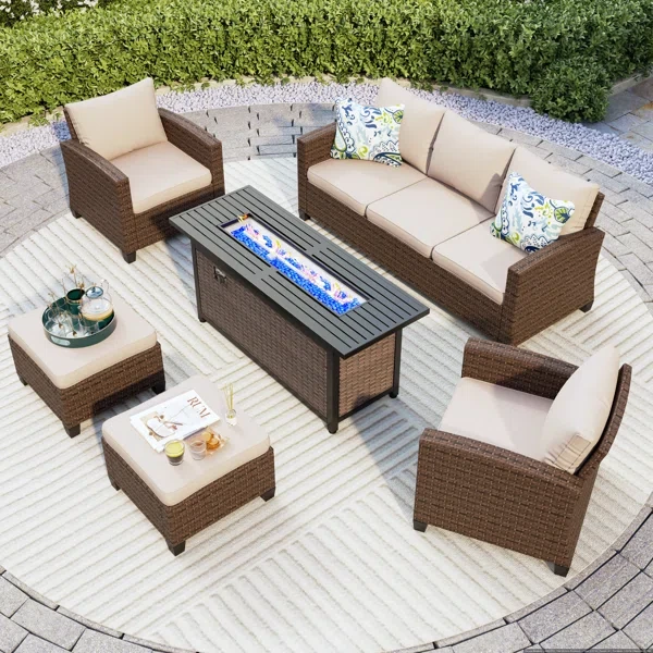 Argyri 7 - Person Outdoor Wicker Patio Conversation Furniture Set with Fire Pit Table