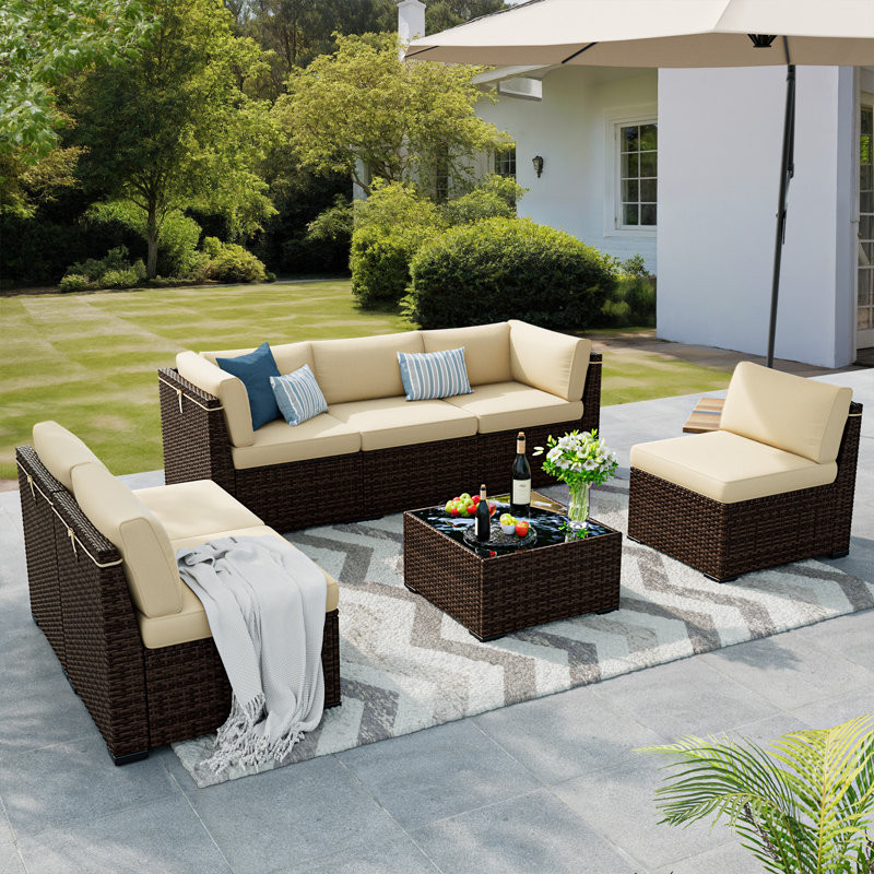 Mecayla 7 Piece Rattan Sectional Seating Group with Cushions