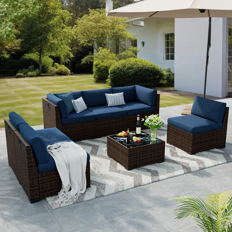 Mecayla 7 Piece Rattan Sectional Seating Group with Cushions