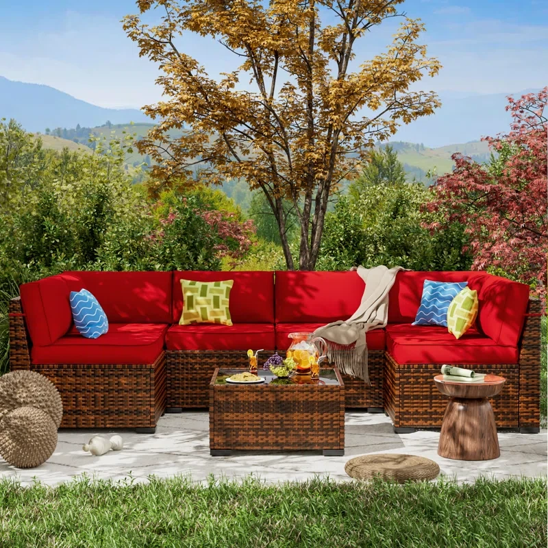 Mecayla 7 Piece Rattan Sectional Seating Group with Cushions