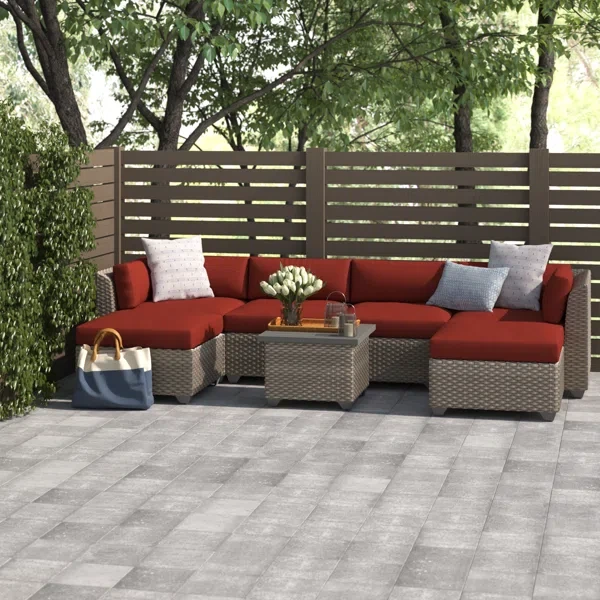 Amjad 7 Piece Outdoor Sectional Seating Group with Cushions