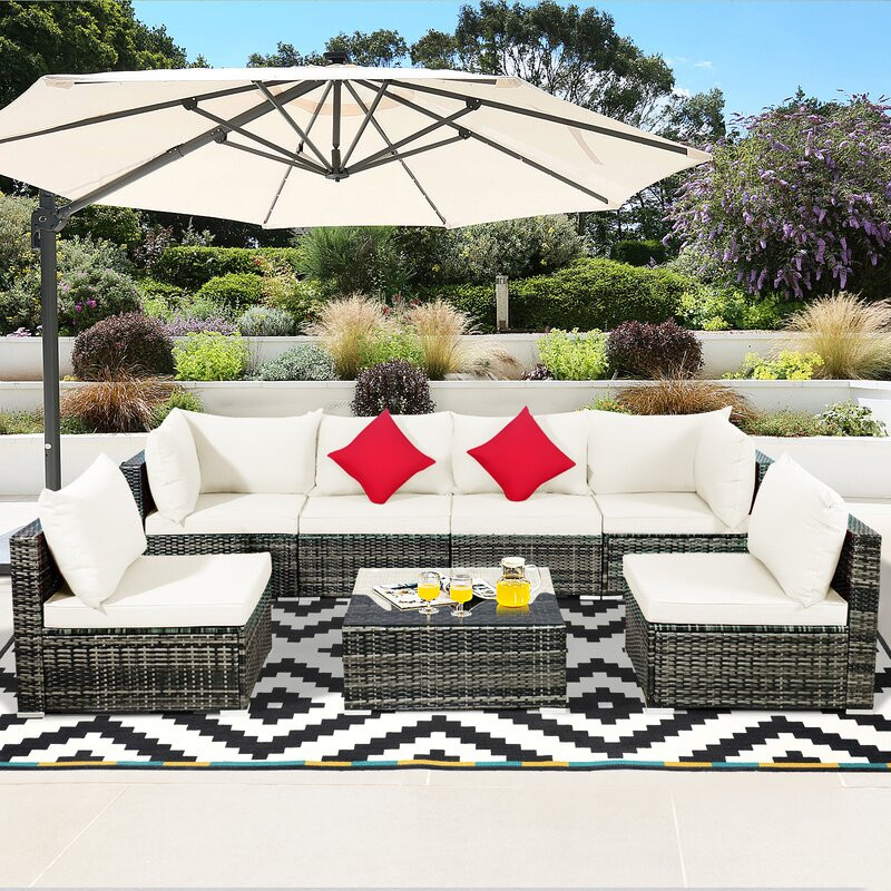 Amarjeet 7 Piece Rattan Sectional Seating Group with Cushions