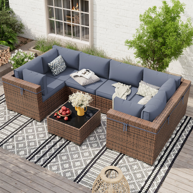 Mecayla 7 Piece Rattan Sectional Seating Group with Cushions