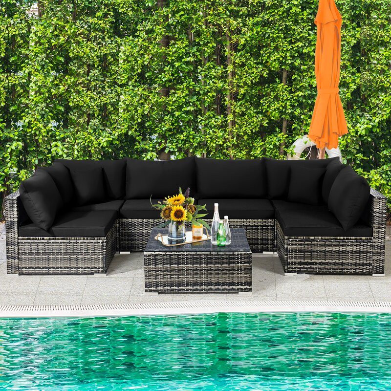 Amarjeet 7 Piece Rattan Sectional Seating Group with Cushions