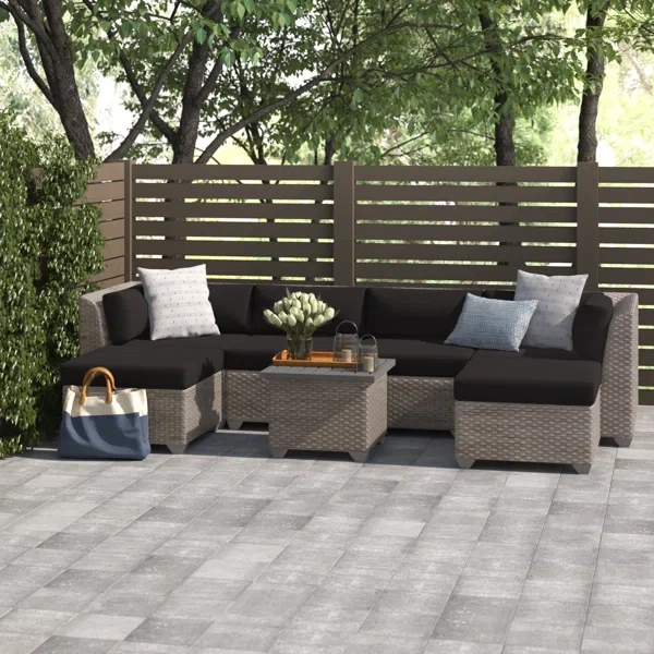 Amjad 7 Piece Outdoor Sectional Seating Group with Cushions