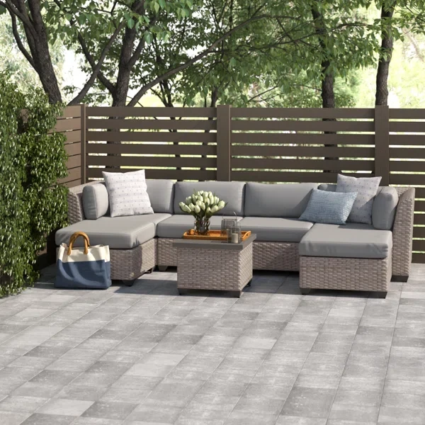 Amjad 7 Piece Outdoor Sectional Seating Group with Cushions