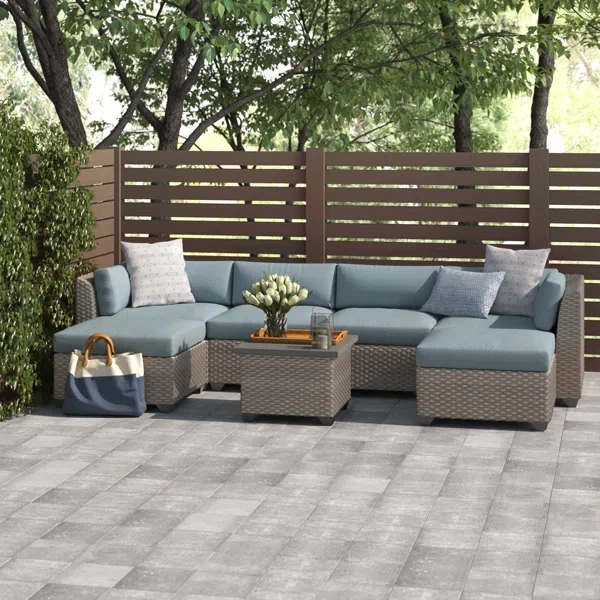 Amjad 7 Piece Outdoor Sectional Seating Group with Cushions