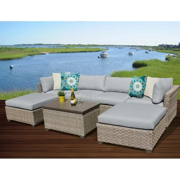 Anupras 7 Piece Rattan Sectional Seating Group with Cushions