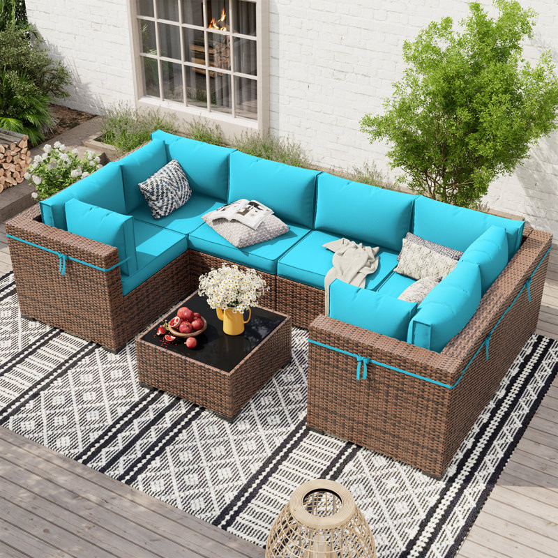 Mecayla 7 Piece Rattan Sectional Seating Group with Cushions