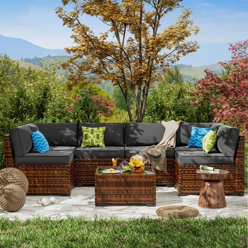 Mecayla 7 Piece Rattan Sectional Seating Group with Cushions