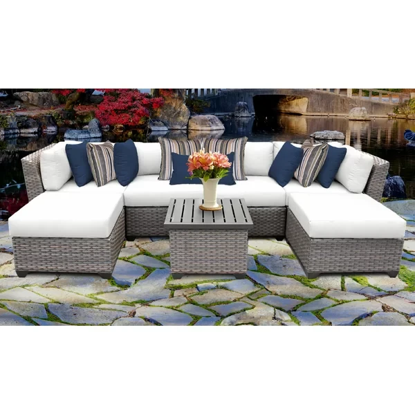 Amjad 7 Piece Outdoor Sectional Seating Group with Cushions