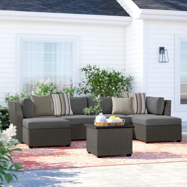 Amjad 7 Piece Outdoor Sectional Seating Group with Cushions