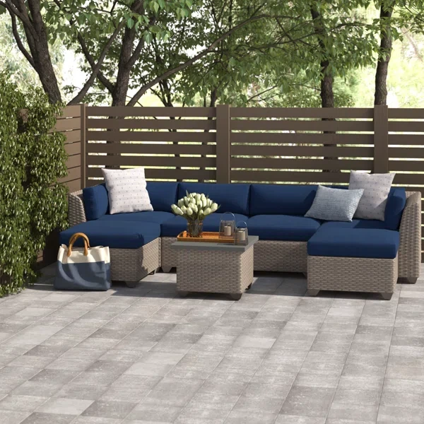 Amjad 7 Piece Outdoor Sectional Seating Group with Cushions