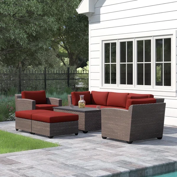 Amjad 8 Piece Outdoor Sectional Seating Group with Cushions